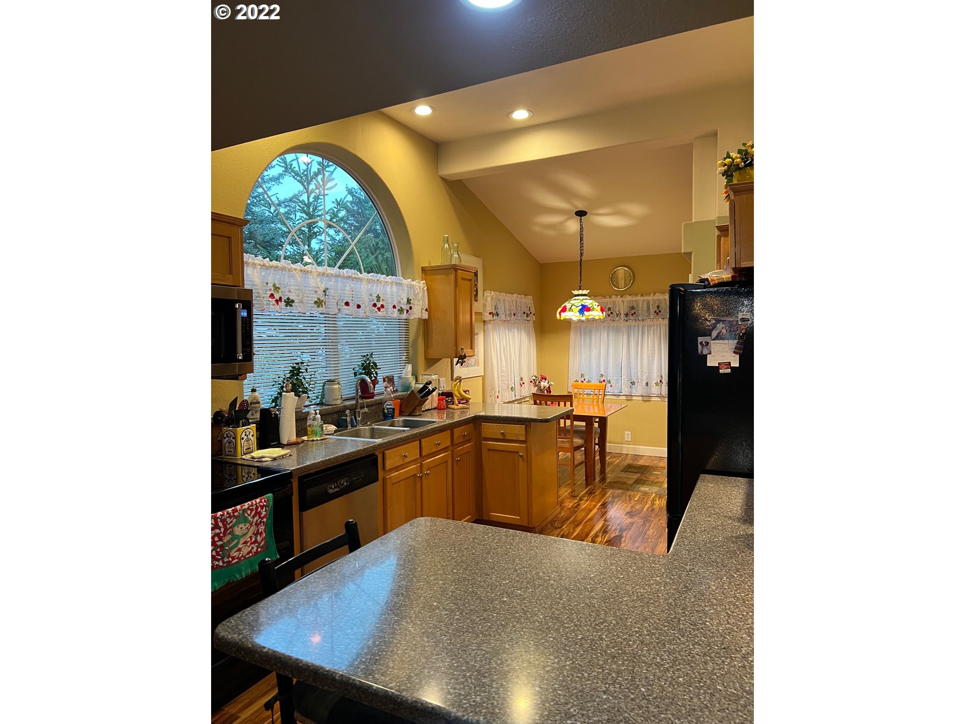 931 30th Way Florence, OR 97439 - Photo 12 of 23 a kitchen with stainless steel appliances granite countertop a sink counter space and cabinets