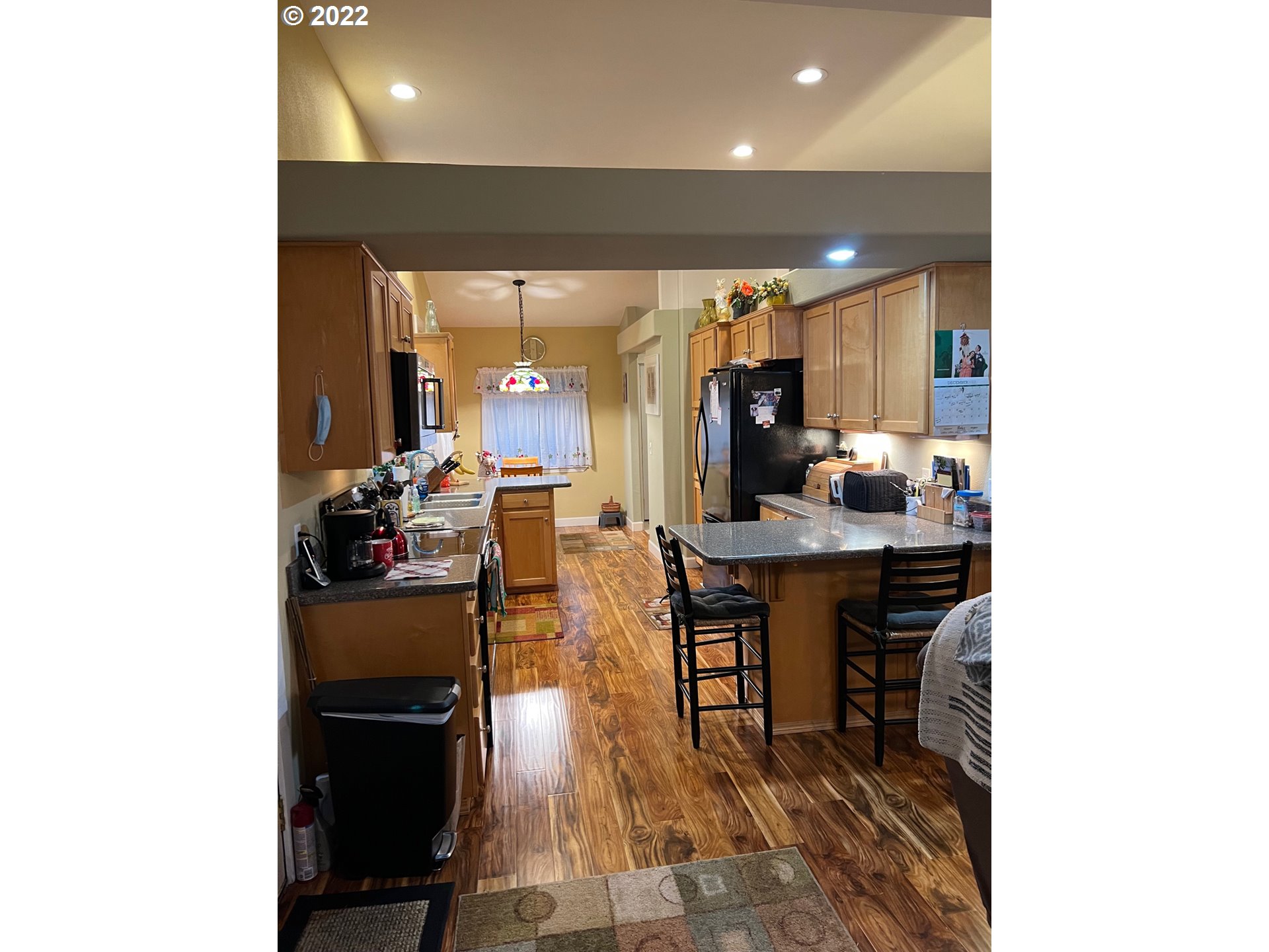 931 30th Way Florence, OR 97439 - Photo 14 of 23 a dining room with furniture and a kitchen