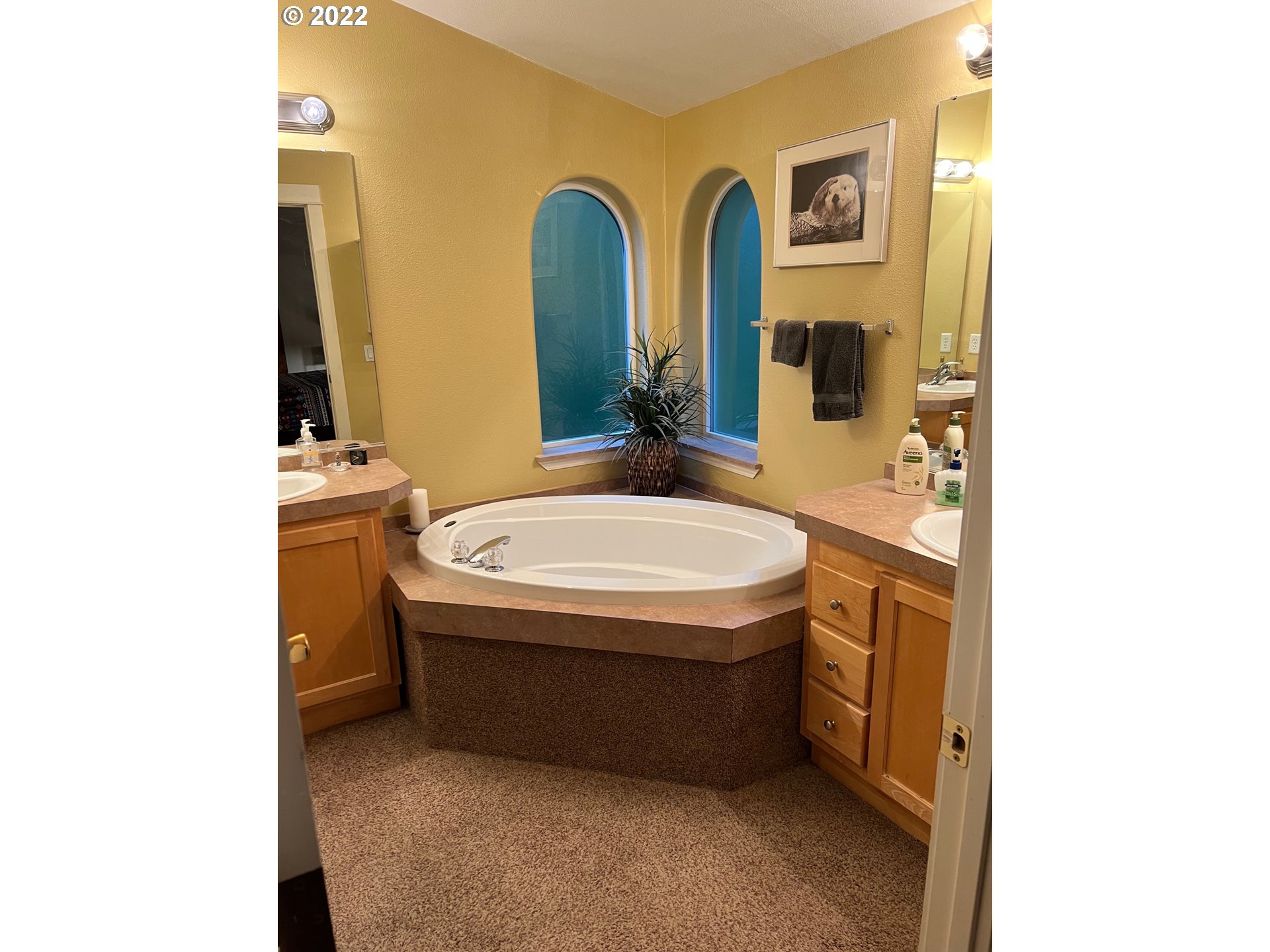 931 30th Way Florence, OR 97439 - Photo 16 of 23 a bathroom with a tub sink and mirror