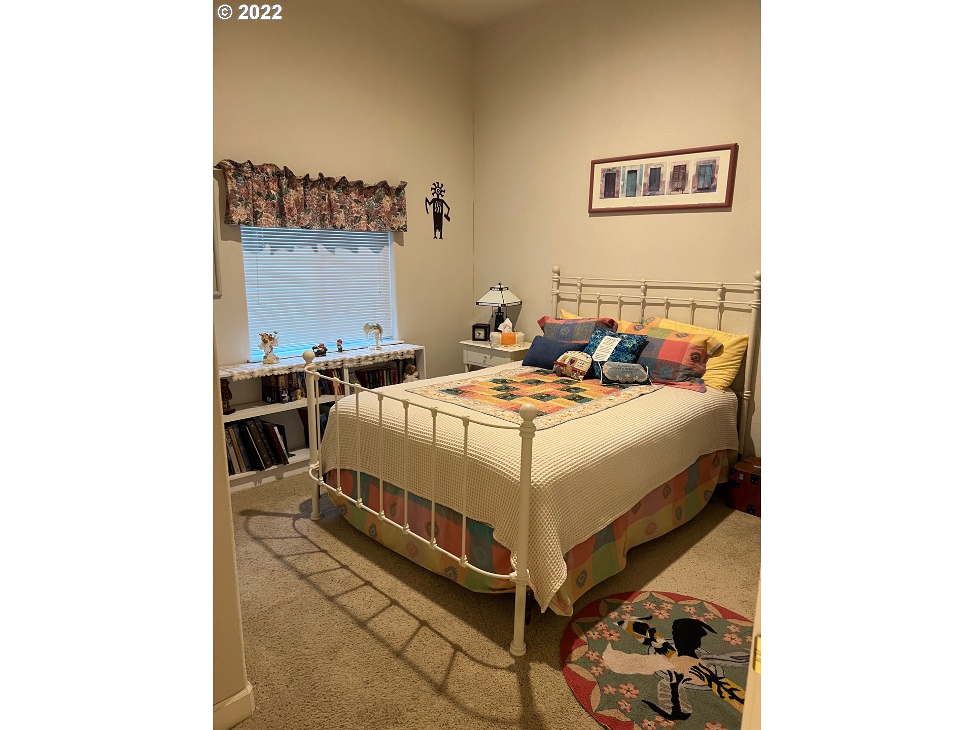 931 30th Way Florence, OR 97439 - Photo 19 of 23 a bed room with a bed and a chair