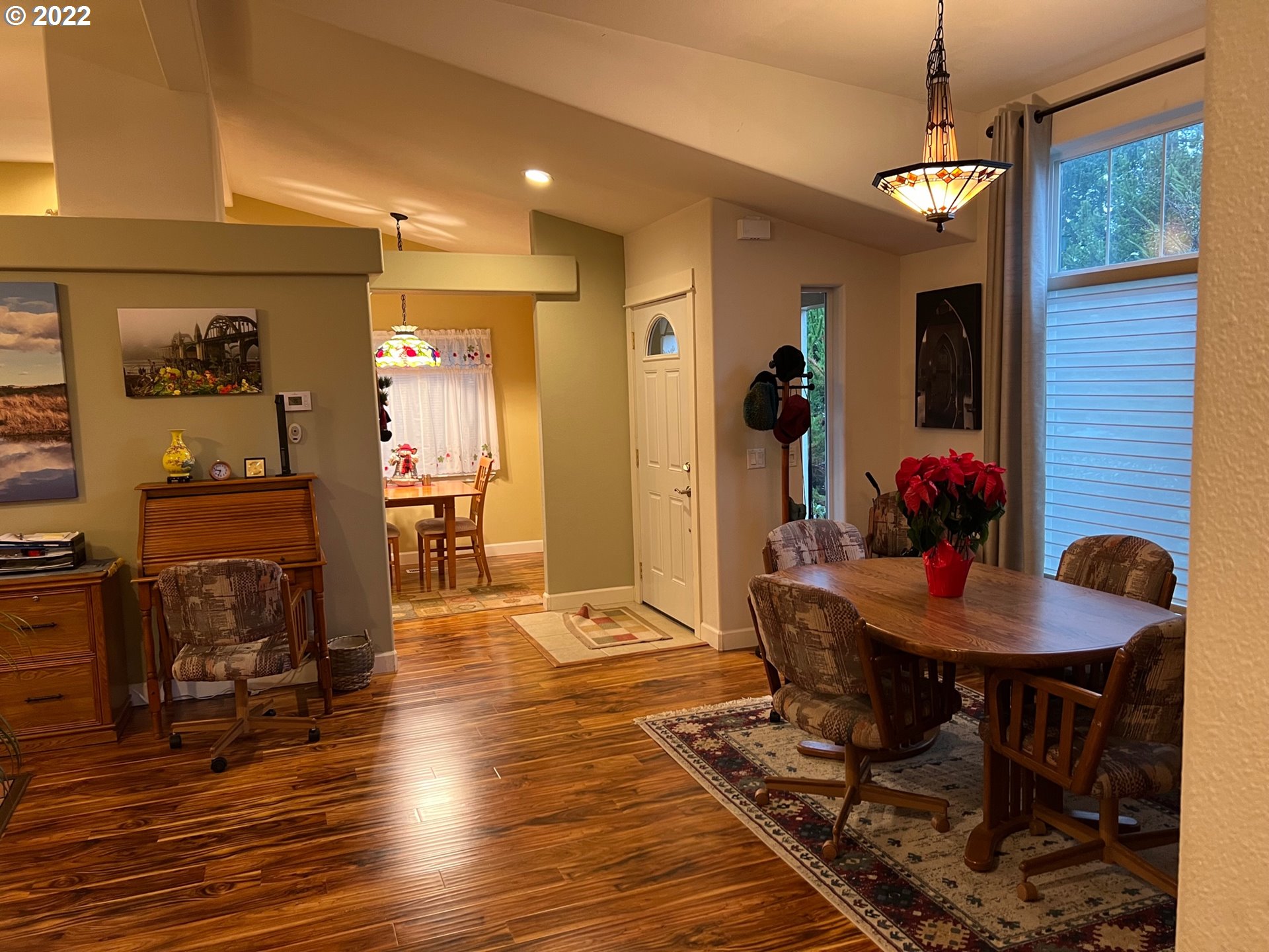 931 30th Way Florence, OR 97439 - Photo 7 of 23 a view of a dining room with furniture wooden floor and a chandelier