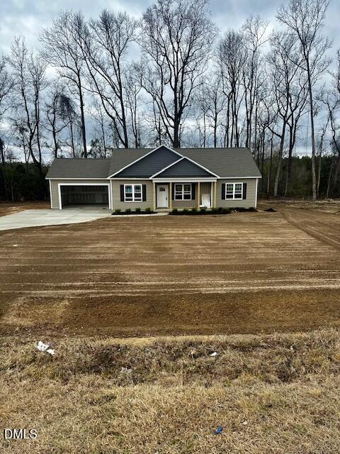 1061 Nor-Am Road Pikeville, NC 27863 - Photo 2 of 5 a front view of a house with a garden