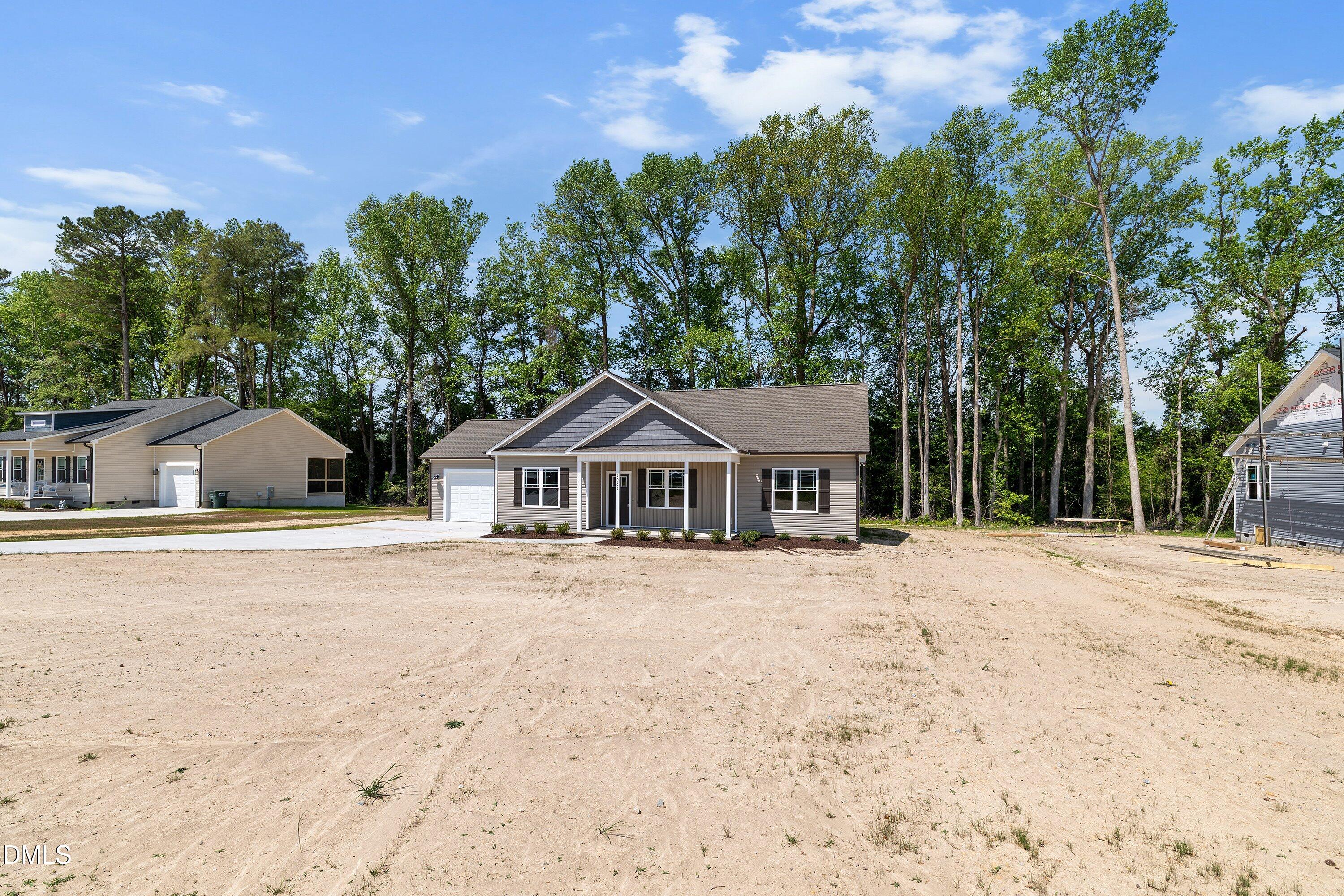 1061 Nor-Am Road Pikeville, NC 27863 - Photo 3 of 39 front view of a house with a yard