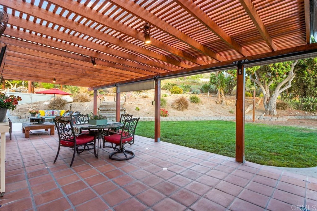 1801 Redwing Way San Marcos, CA 92078 - Photo 11 of 43 a view of a porch with chairs and backyard