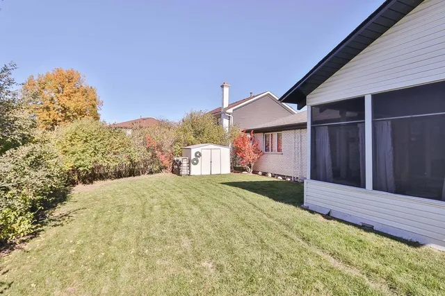 a aerial view of multiple houses with yard