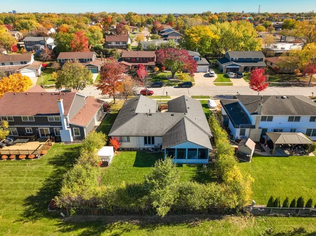 an aerial view of a house with a swimming pool