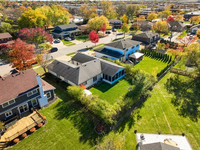 an aerial view of residential houses with outdoor space