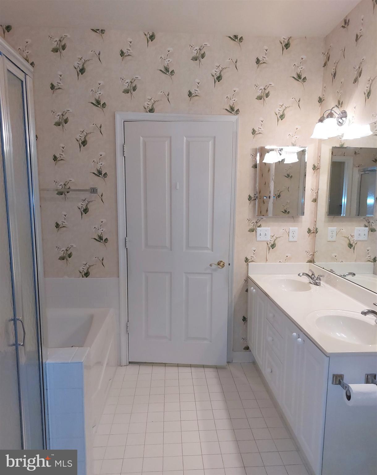 2500 Waterside Drive, Unit 306 Frederick, MD 21701 - Photo 15 of 23 Primary bath with tub and shower