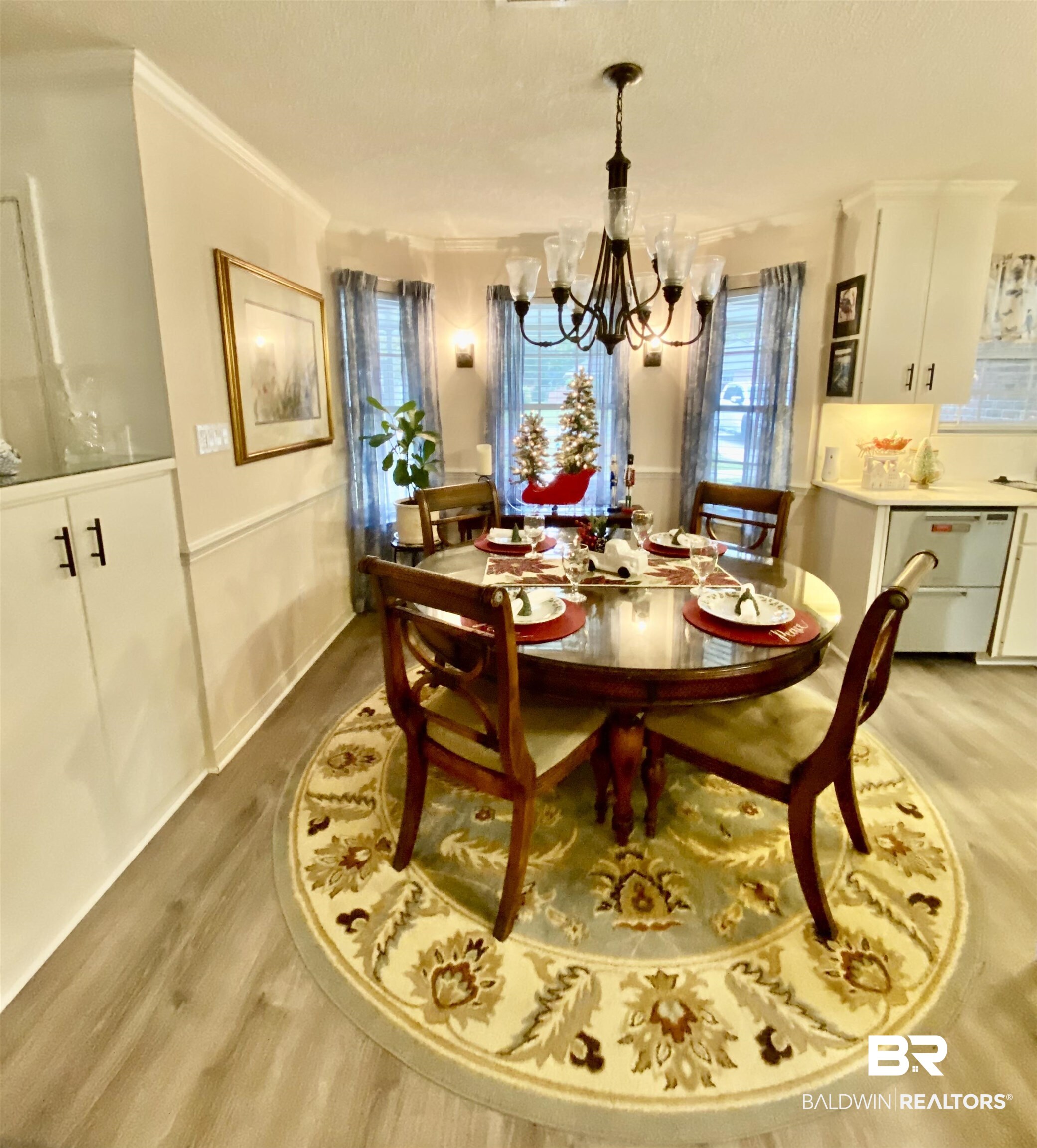 2872 Avenida Alberto Lillian, AL 36549 - Photo 11 of 31 Dining area featuring ornamental molding, a chandelier, and light hardwood / wood-style floors