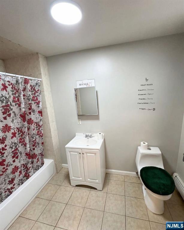 255 Franklin Street Elizabeth, NJ 07206 - Photo 11 of 34 a bathroom with a sink a toilet and mirror