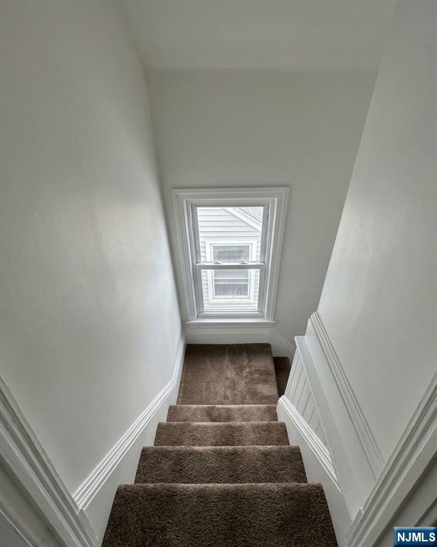255 Franklin Street Elizabeth, NJ 07206 - Photo 16 of 34 a view of staircase with white walls and a window