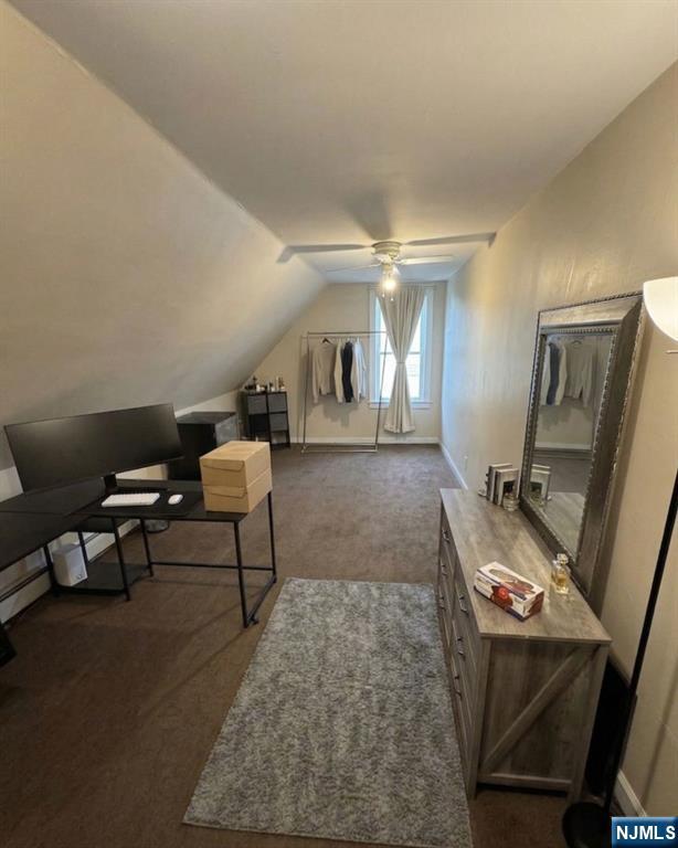 255 Franklin Street Elizabeth, NJ 07206 - Photo 24 of 34 a living room with furniture and a flat screen tv