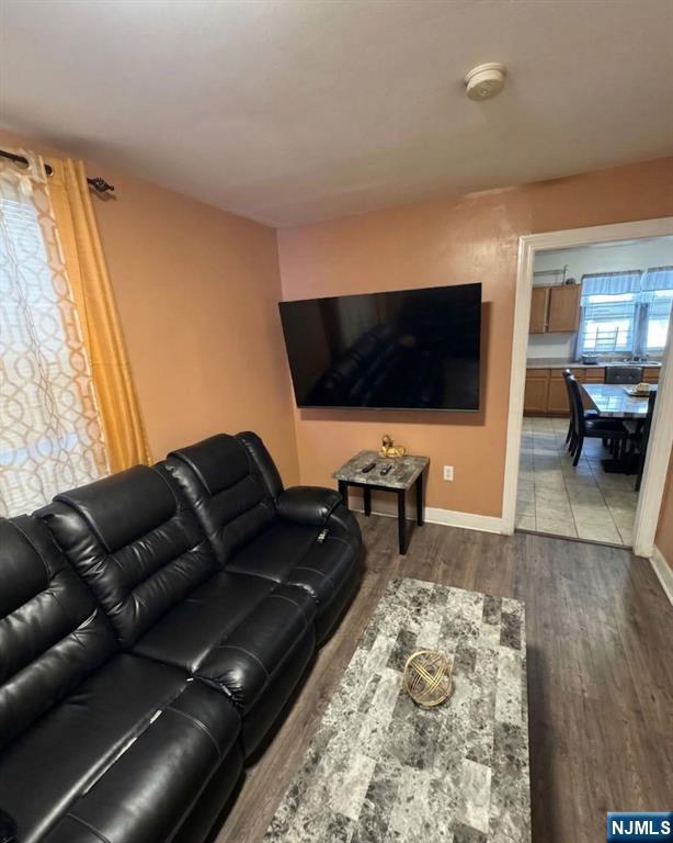 255 Franklin Street Elizabeth, NJ 07206 - Photo 26 of 34 a living room with furniture and a flat screen tv