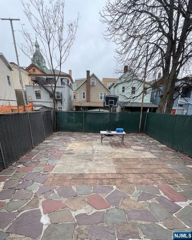255 Franklin Street Elizabeth, NJ 07206 - Photo 33 of 34 a view of a backyard with a snow on the road