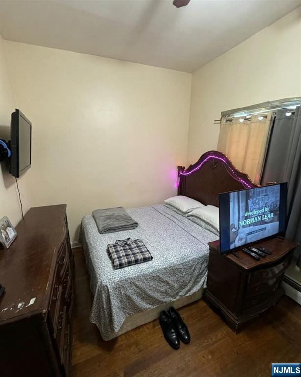 255 Franklin Street Elizabeth, NJ 07206 - Photo 5 of 34 a bedroom with a bed a desk and chair