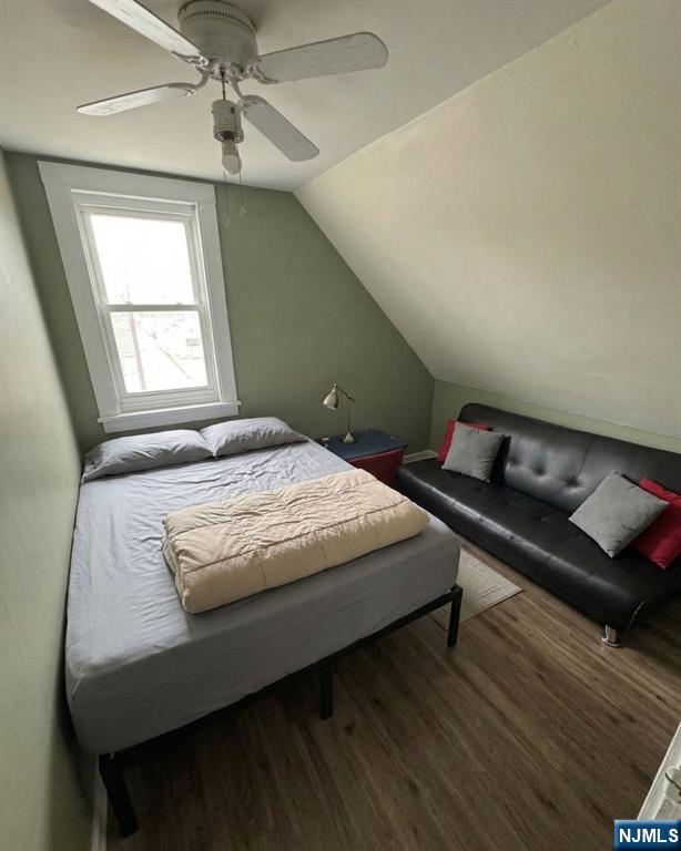 255 Franklin Street Elizabeth, NJ 07206 - Photo 6 of 34 a bedroom with bed and window