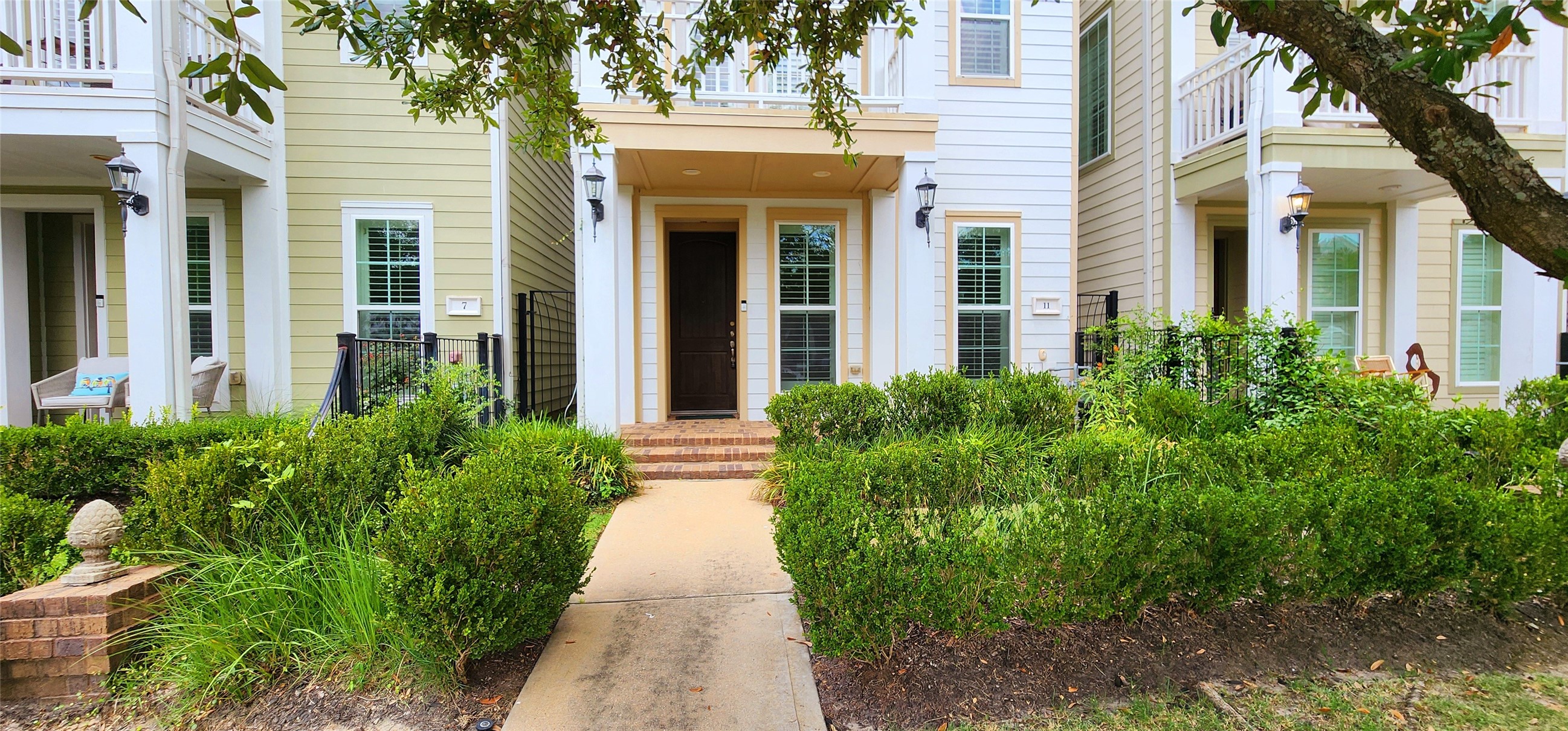 11 West Rafters Row The Woodlands, TX 77380 - Photo 2 of 31 front view of a house with a large windows
