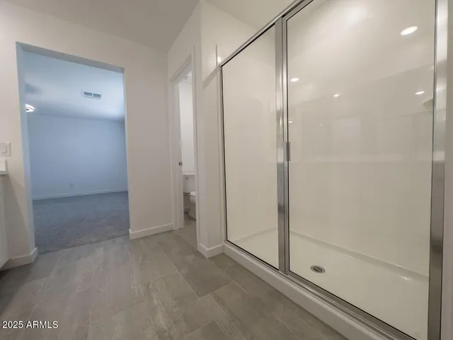 a bathroom with double sink and a mirror