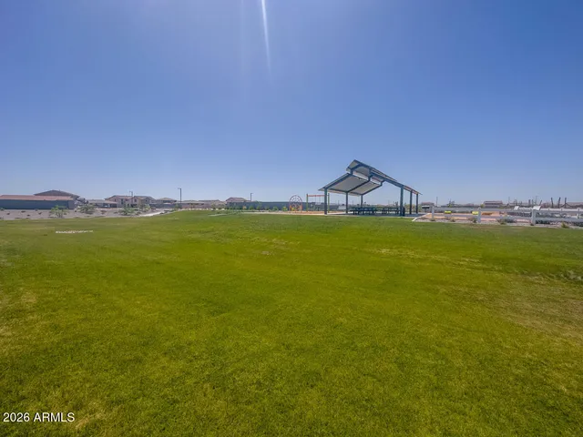 a view of a swimming pool with a table and chairs