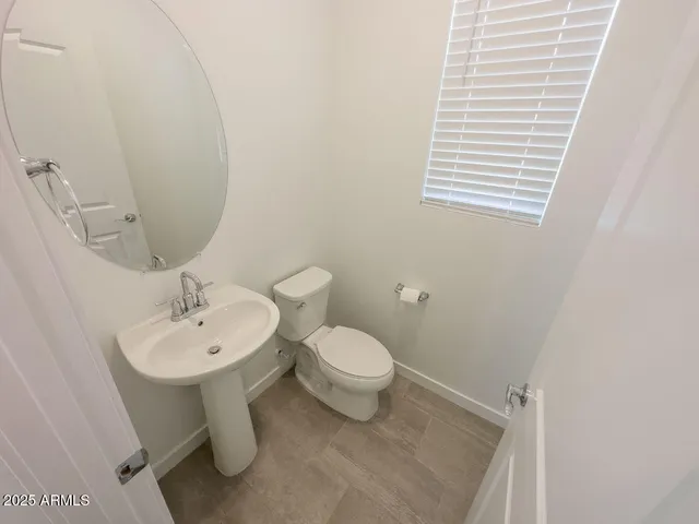 a bathroom with a toilet sink