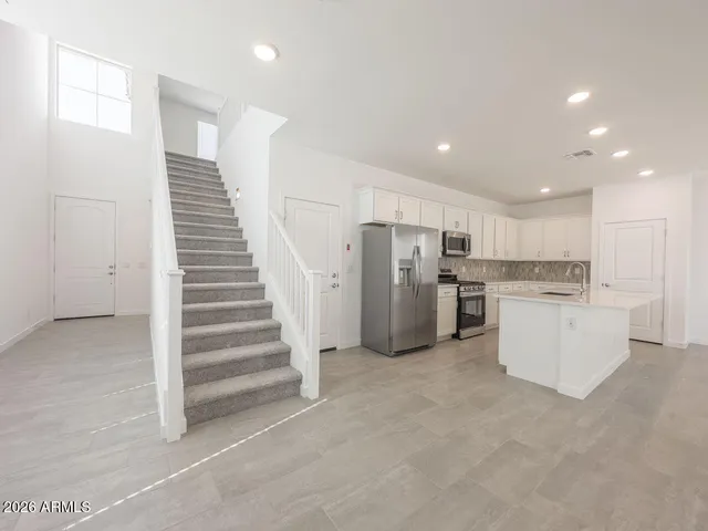 a view of a kitchen with a sink and a dishwasher
