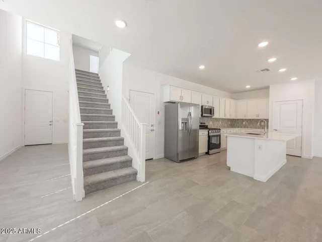 a view of a kitchen with a sink and a dishwasher