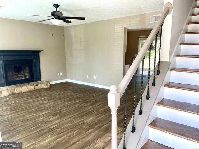 a view of an entryway with wooden floor