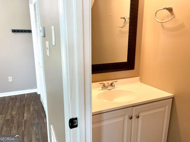 a bathroom with a sink and a mirror