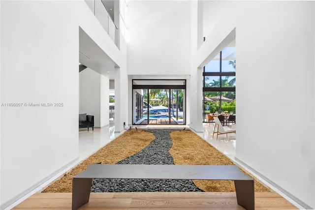 a bedroom with a large bed and a large window