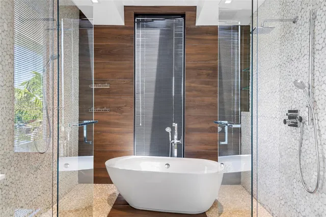 a spacious bedroom with a bed and a large window