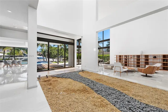 a bedroom with a bed couches and a couch