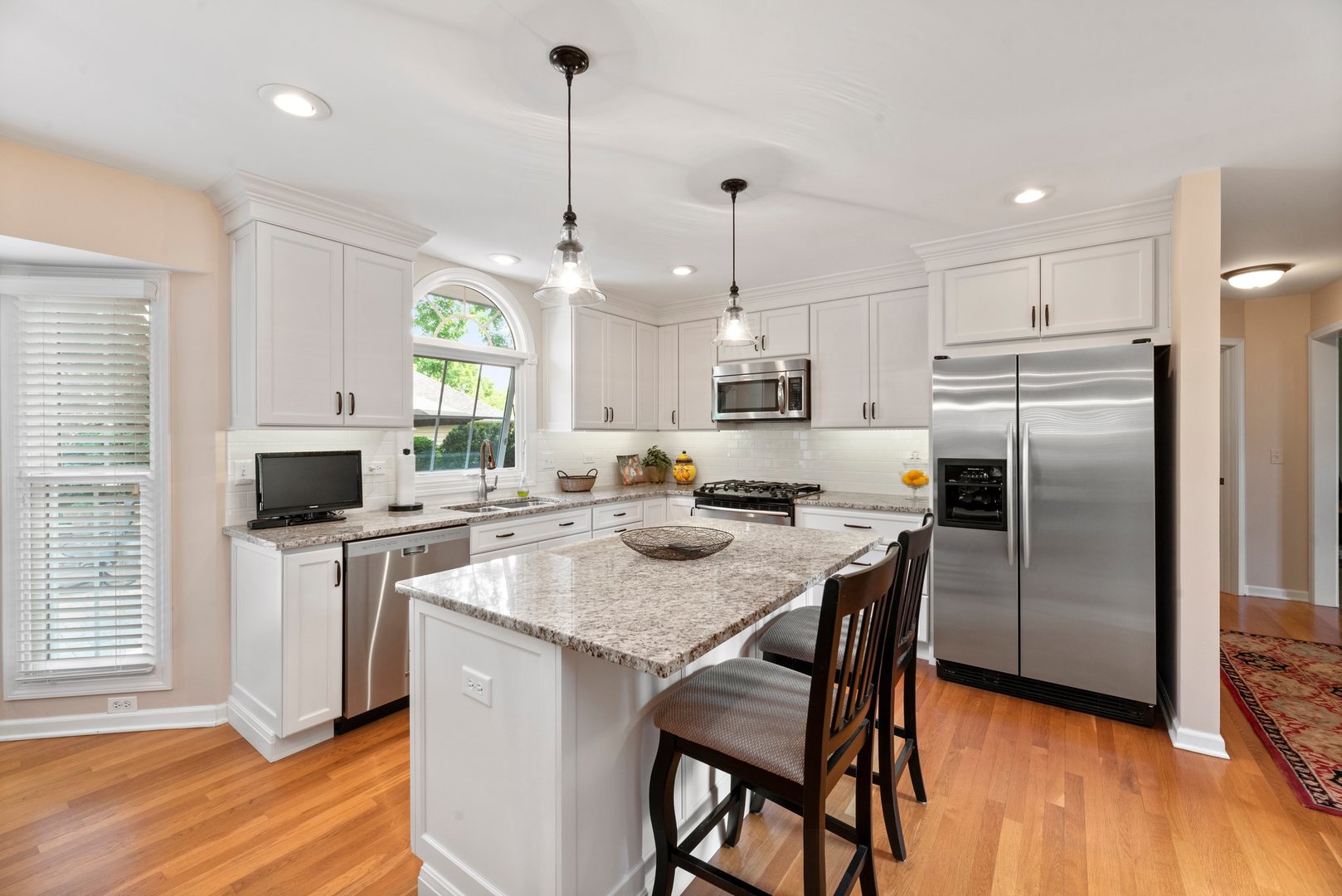 1620 Grommon Road Naperville, IL 60564 - Photo 11 of 53 a kitchen with stainless steel appliances granite countertop a sink a stove a refrigerator cabinets and a kitchen island