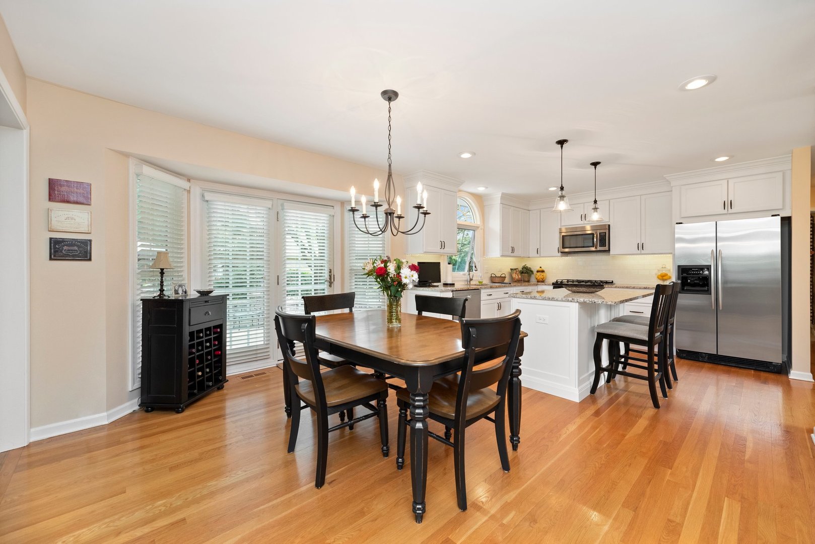 1620 Grommon Road Naperville, IL 60564 - Photo 13 of 53 a kitchen with stainless steel appliances kitchen island granite countertop a dining table chairs and granite counter tops