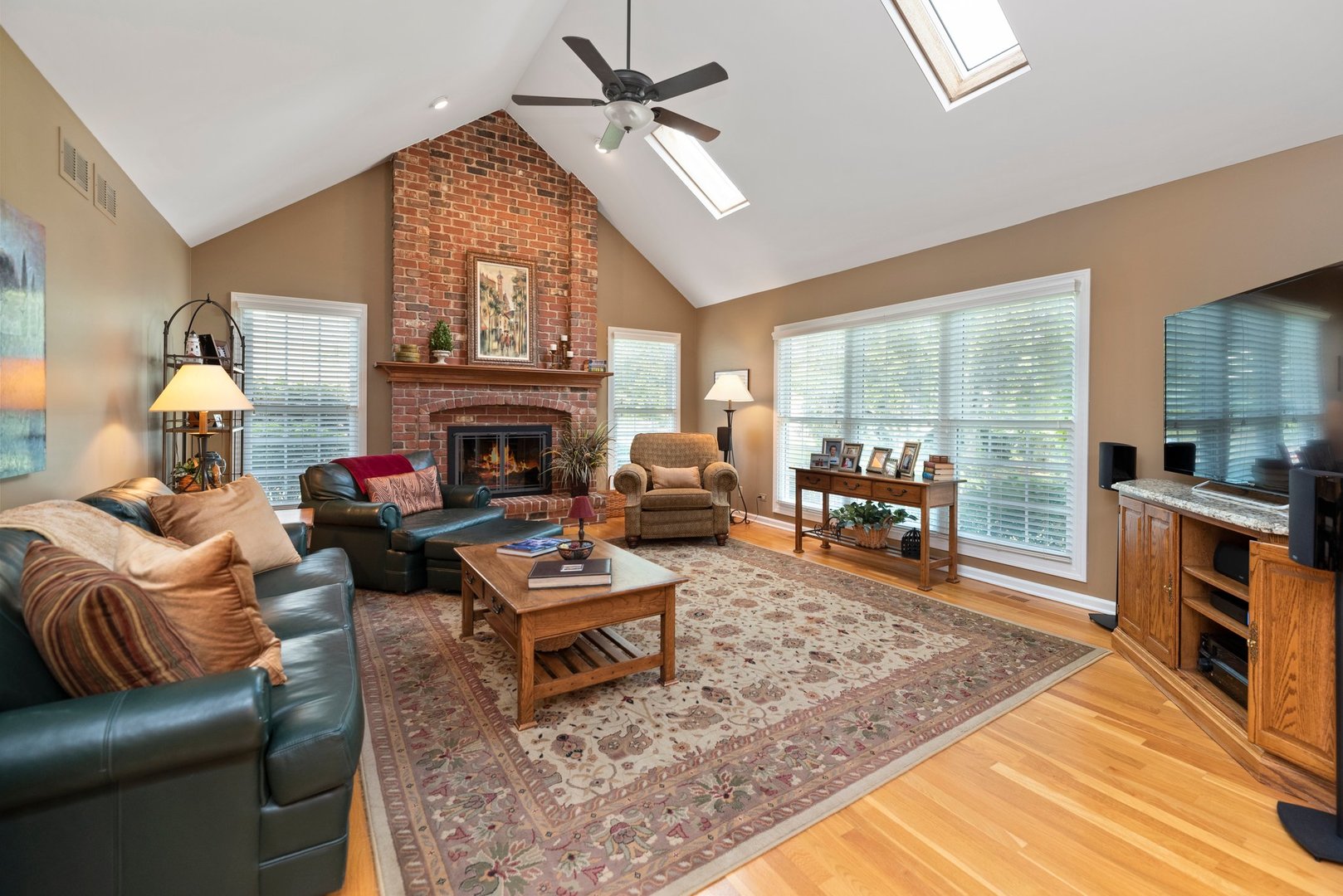 1620 Grommon Road Naperville, IL 60564 - Photo 14 of 53 a living room with furniture a fireplace and a flat screen tv