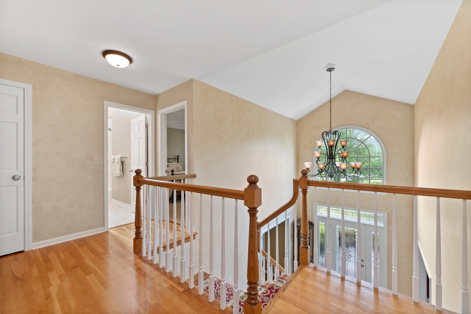 1620 Grommon Road Naperville, IL 60564 - Photo 21 of 53 a view of a hallway with wooden floor and windows