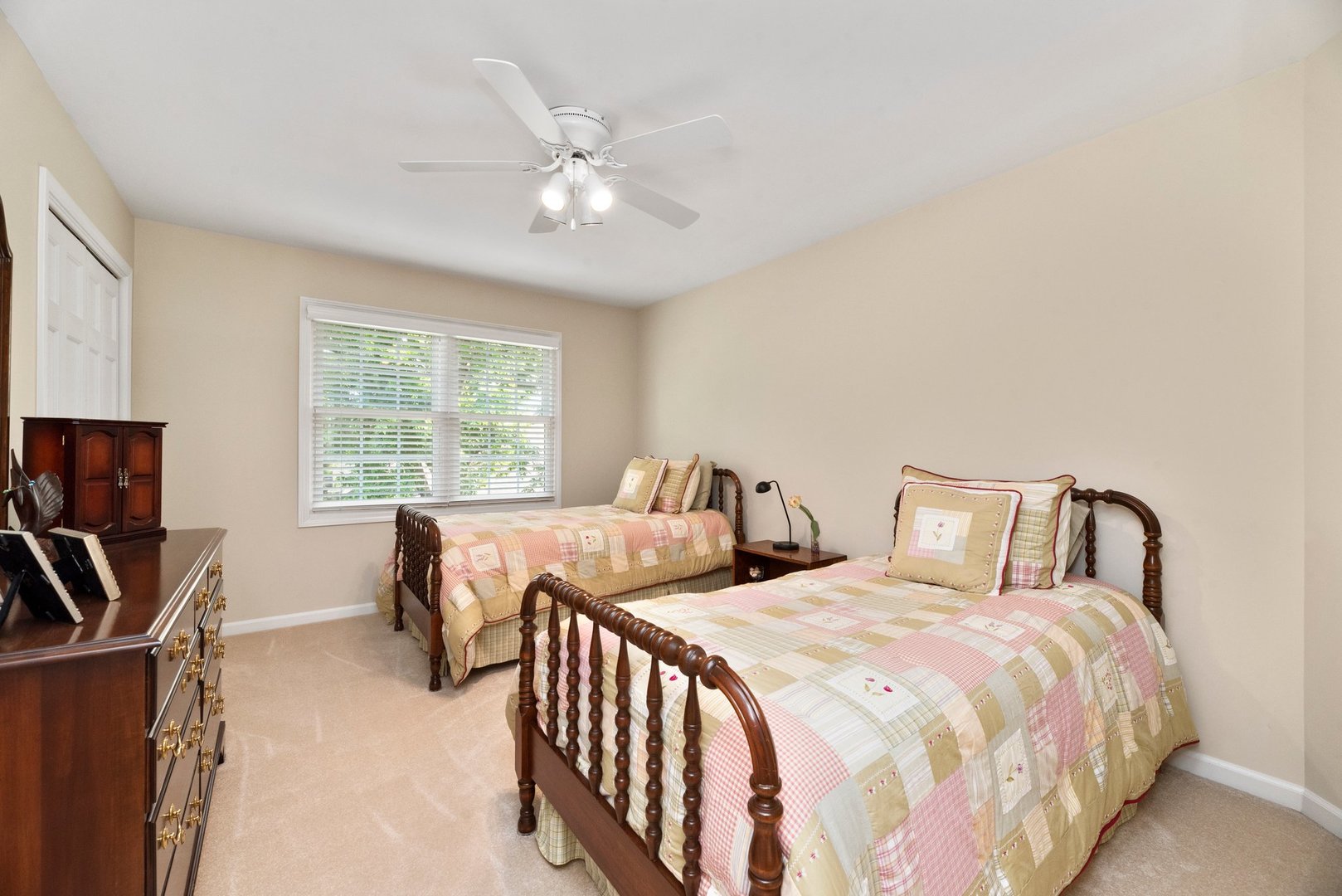 1620 Grommon Road Naperville, IL 60564 - Photo 22 of 53 a bedroom with two beds and a chandelier