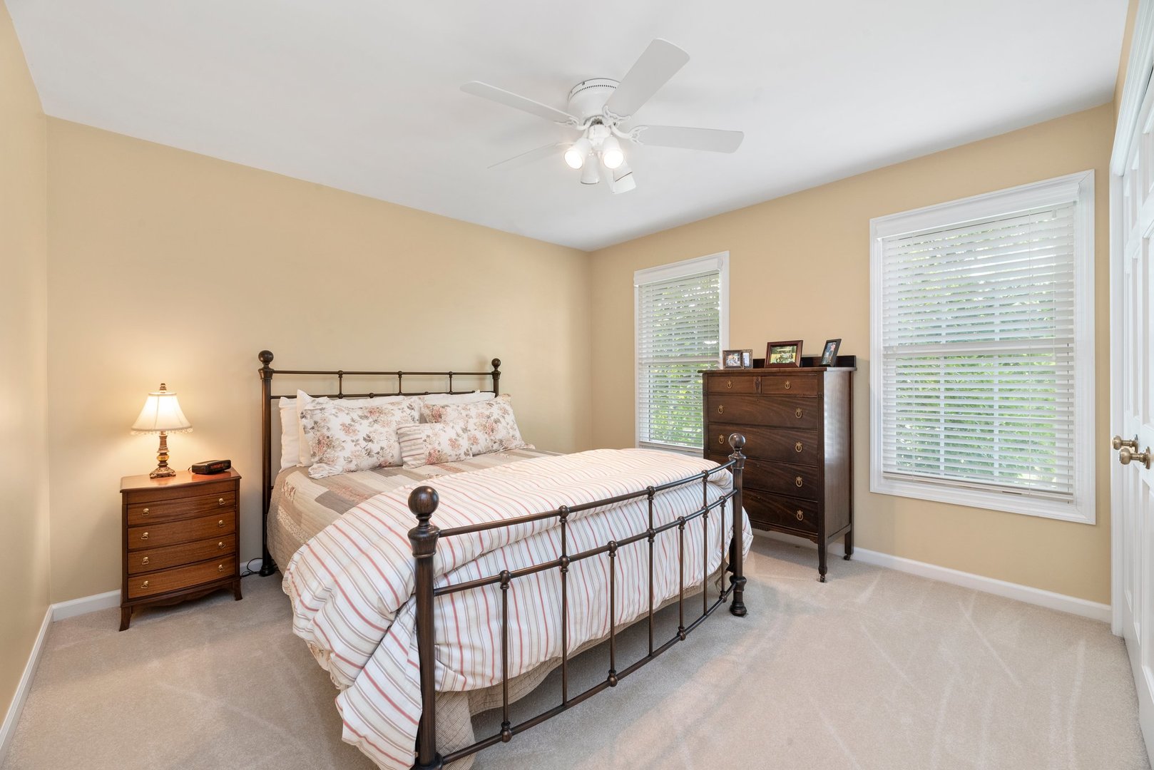 1620 Grommon Road Naperville, IL 60564 - Photo 24 of 53 a bedroom with a bed and a chandelier