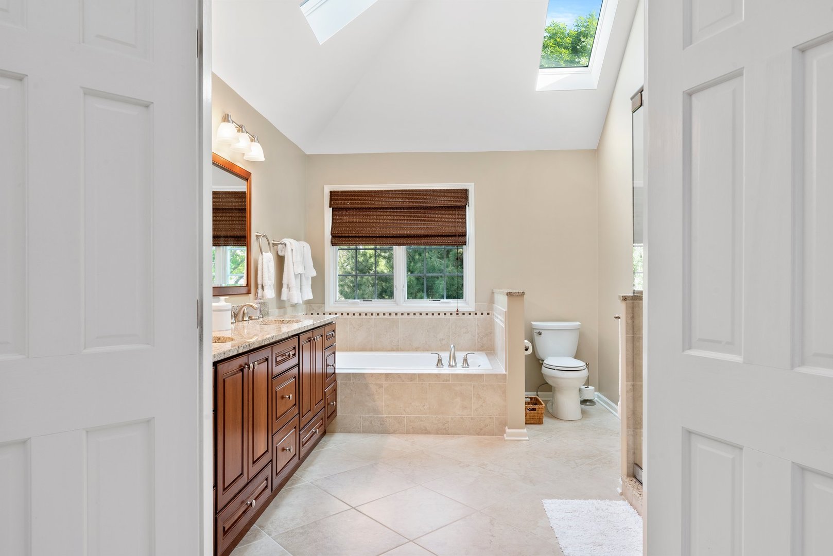 1620 Grommon Road Naperville, IL 60564 - Photo 29 of 53 a spacious bathroom with a granite countertop sink a toilet and a bathtub