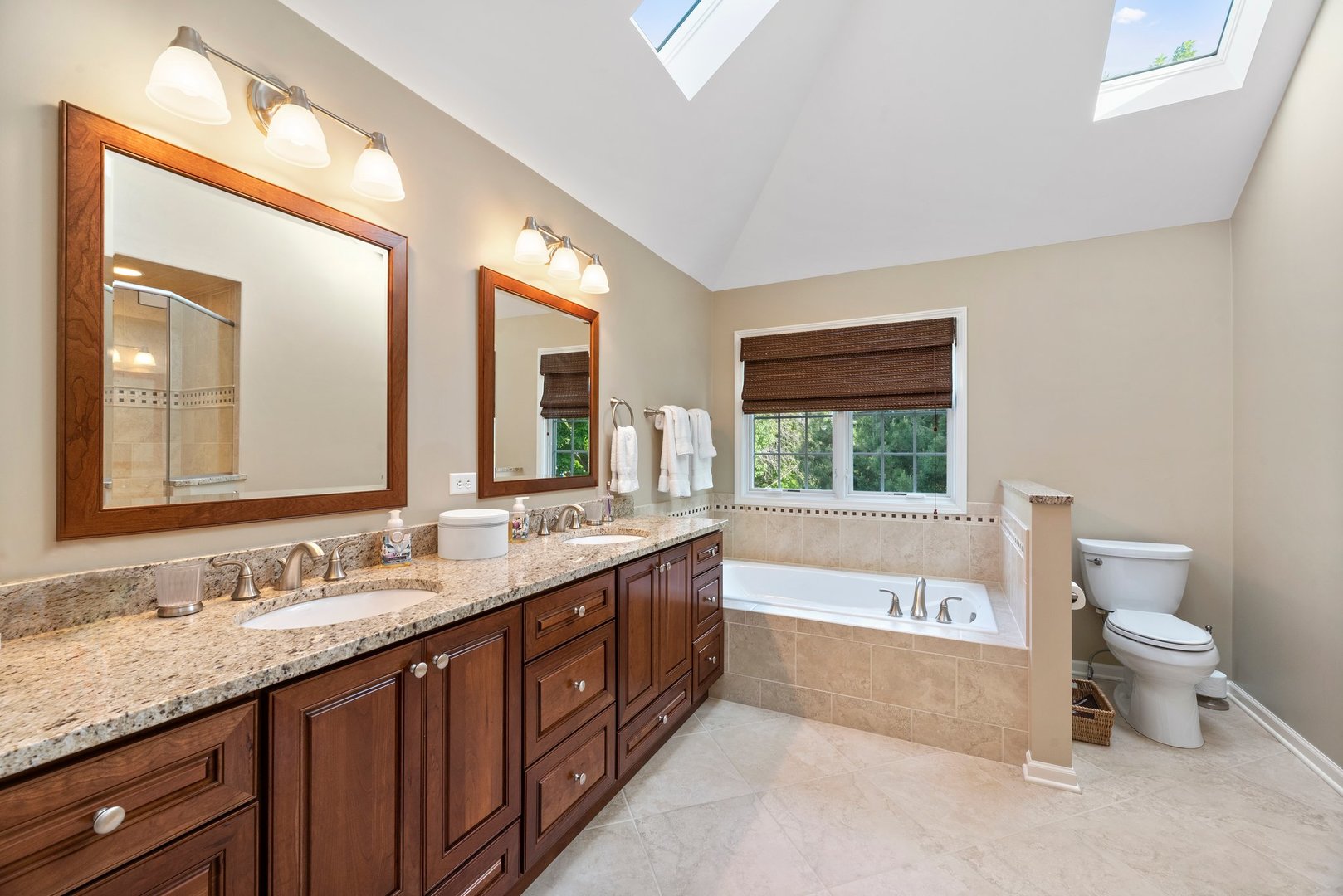 1620 Grommon Road Naperville, IL 60564 - Photo 30 of 53 a spacious bathroom with a granite countertop sink and a large mirror