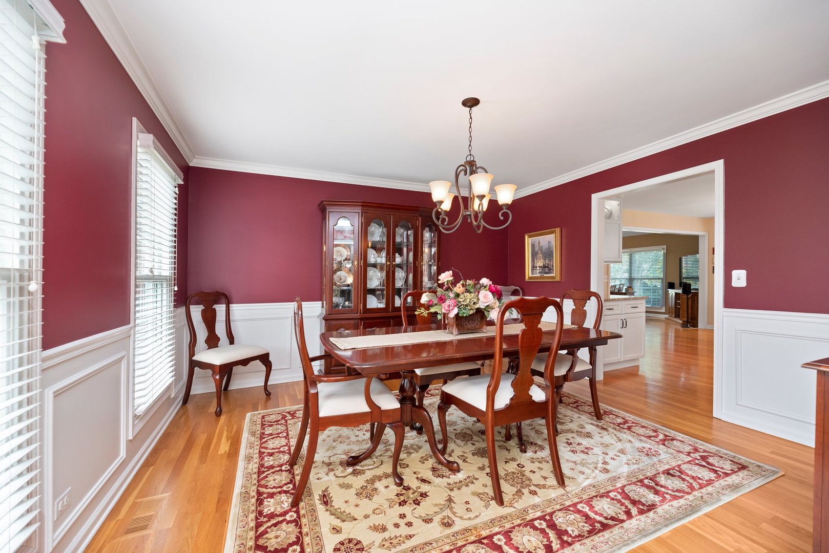 1620 Grommon Road Naperville, IL 60564 - Photo 6 of 53 a view of a dining room with furniture a chandelier and wooden floor
