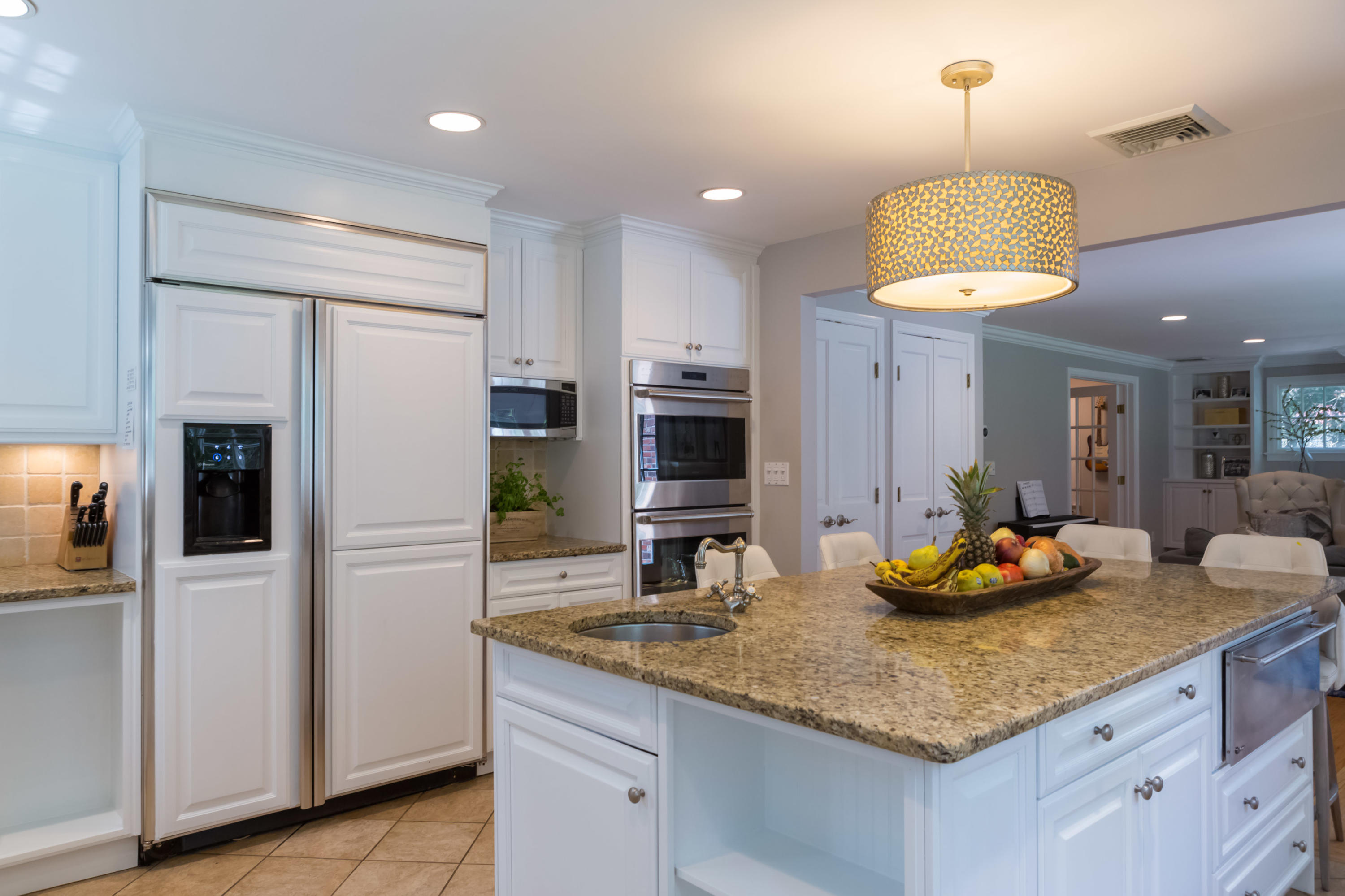 466 Mansfield Avenue Darien, CT 06820 - Photo 16 of 46 a kitchen with granite countertop a refrigerator a stove a sink and a counter space