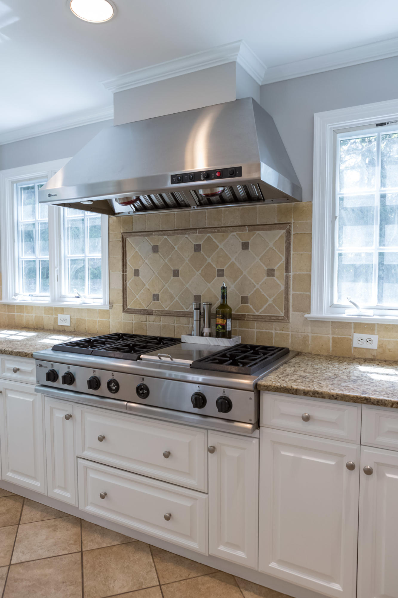 466 Mansfield Avenue Darien, CT 06820 - Photo 17 of 46 a stove top oven sitting inside of a kitchen