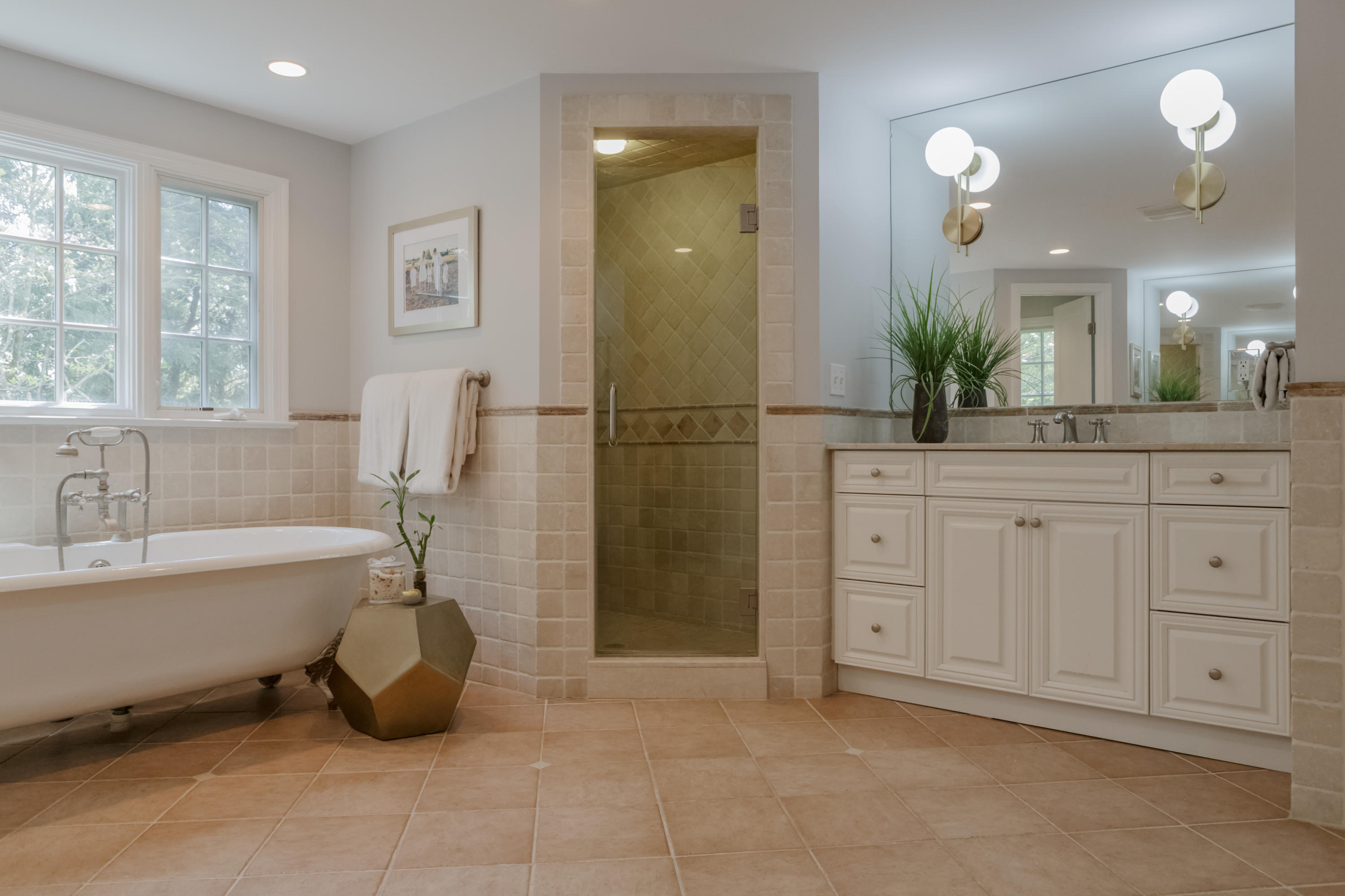 466 Mansfield Avenue Darien, CT 06820 - Photo 26 of 46 a spacious bathroom with a tub sink and mirror