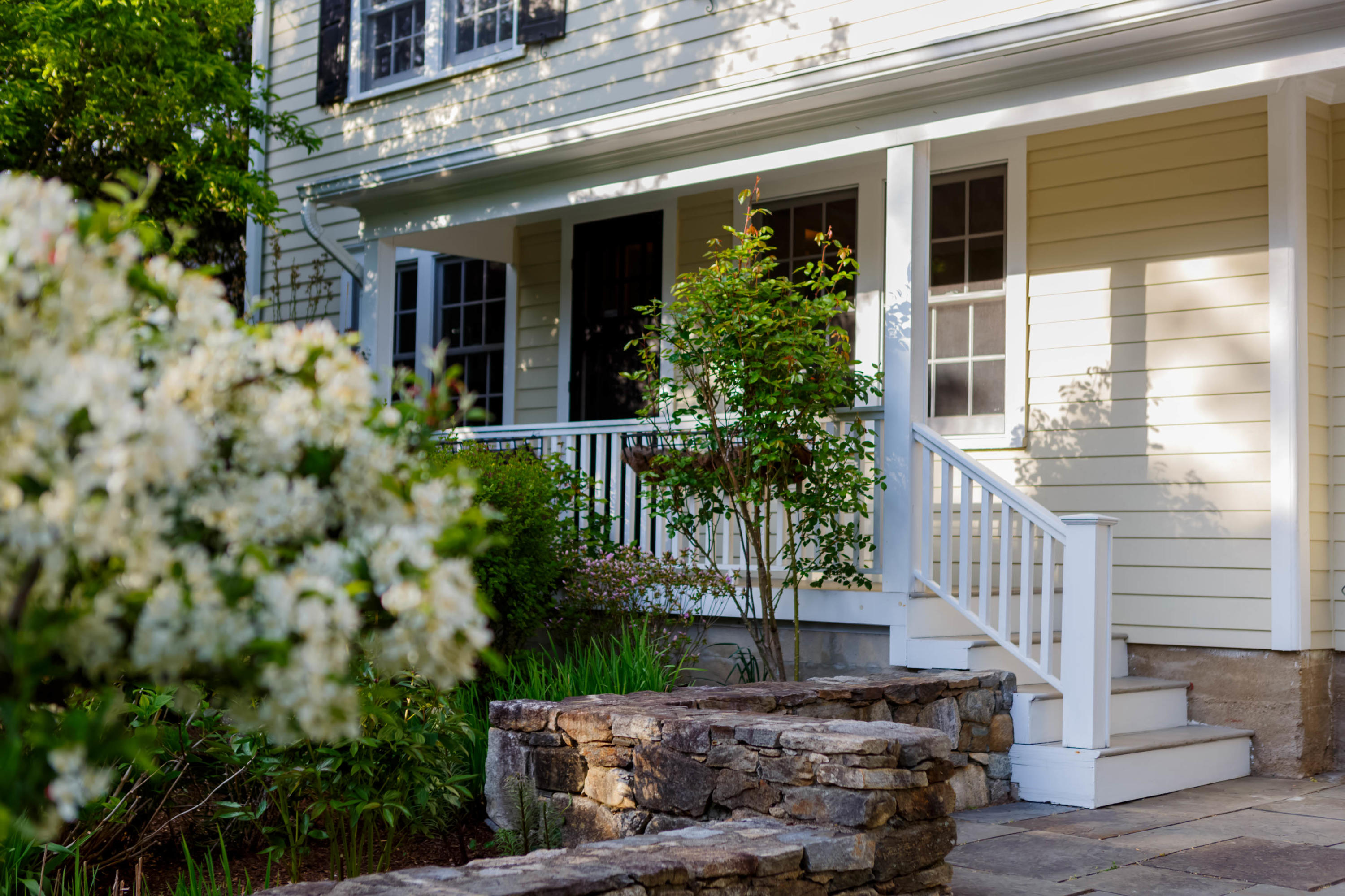 466 Mansfield Avenue Darien, CT 06820 - Photo 44 of 46 a front view of a house with a garden