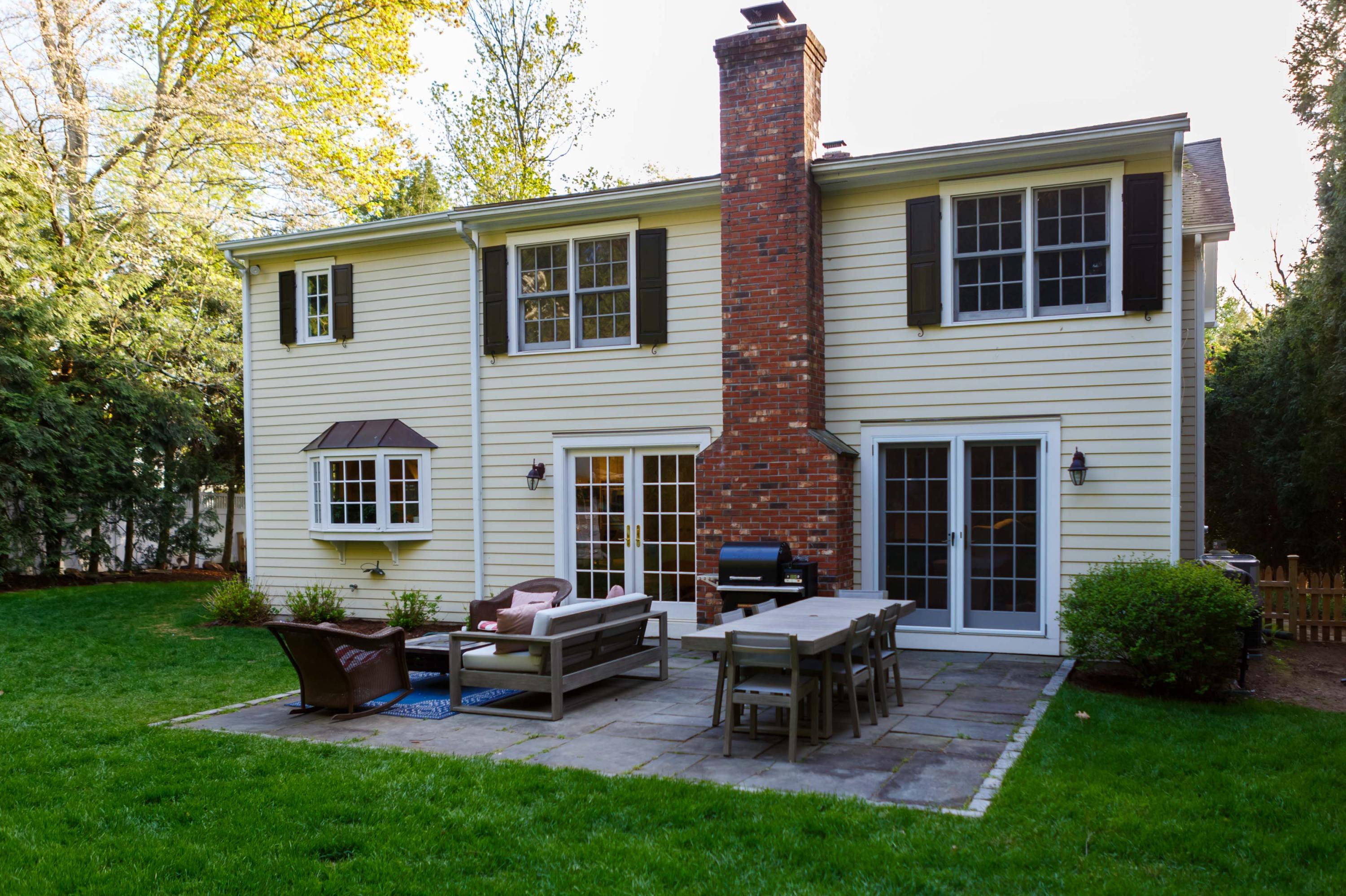466 Mansfield Avenue Darien, CT 06820 - Photo 6 of 46 a backyard of a house with outdoor seating