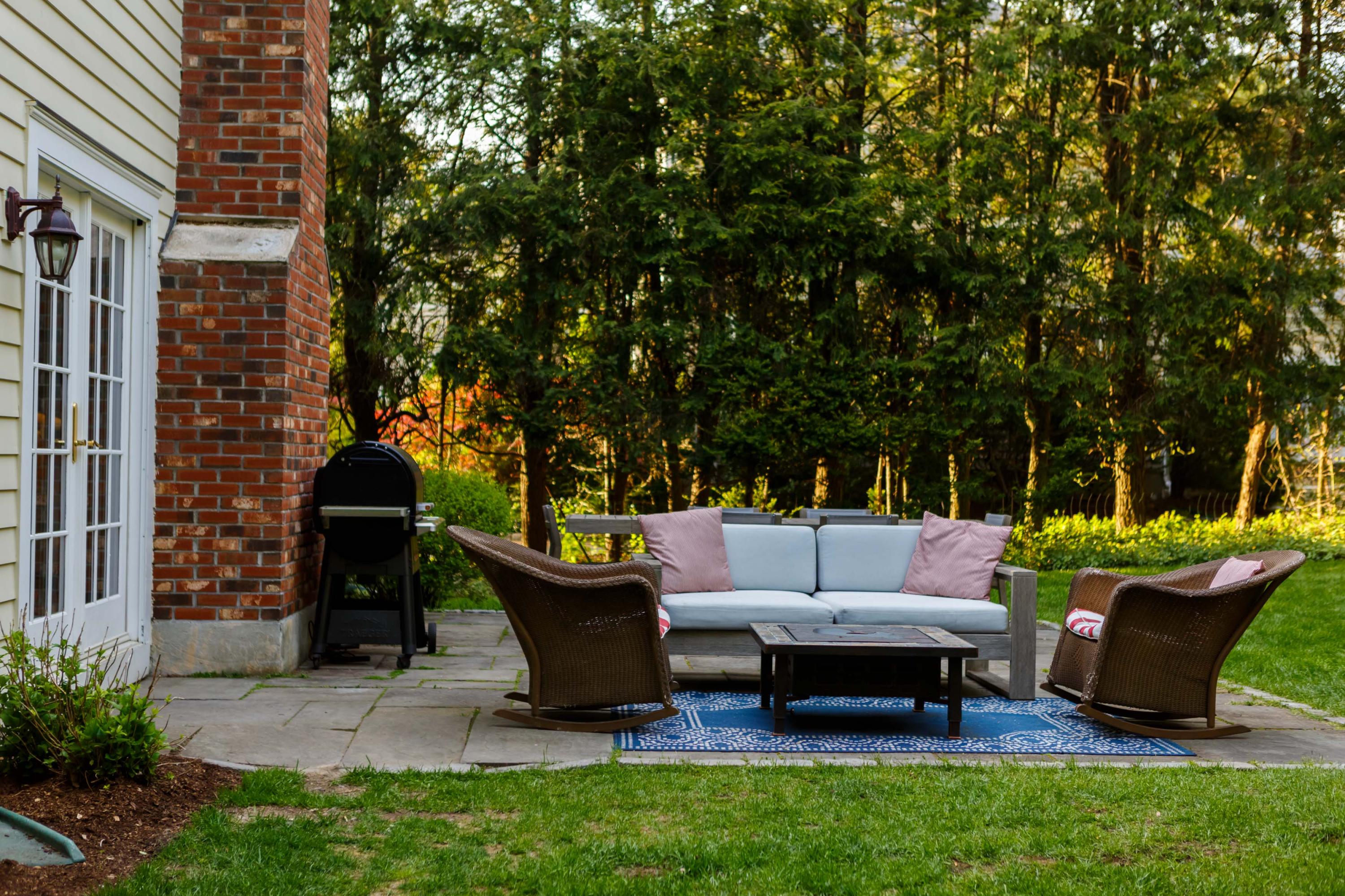 466 Mansfield Avenue Darien, CT 06820 - Photo 7 of 46 a view of a patio with table and chairs potted plants and a large tree