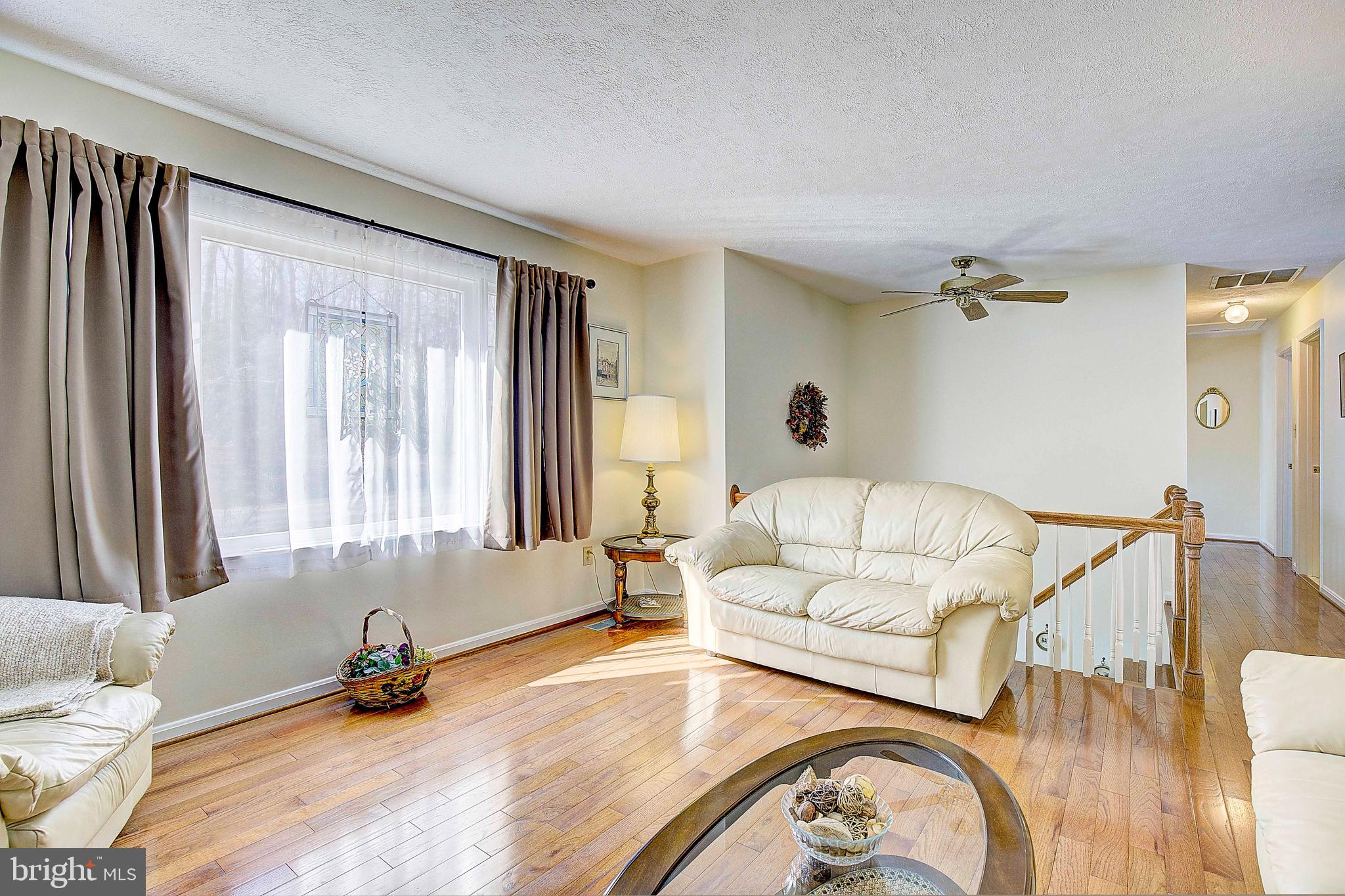 5018 Long Beach Road St. Leonard, MD 20685 - Photo 14 of 39 a living room with furniture and a window