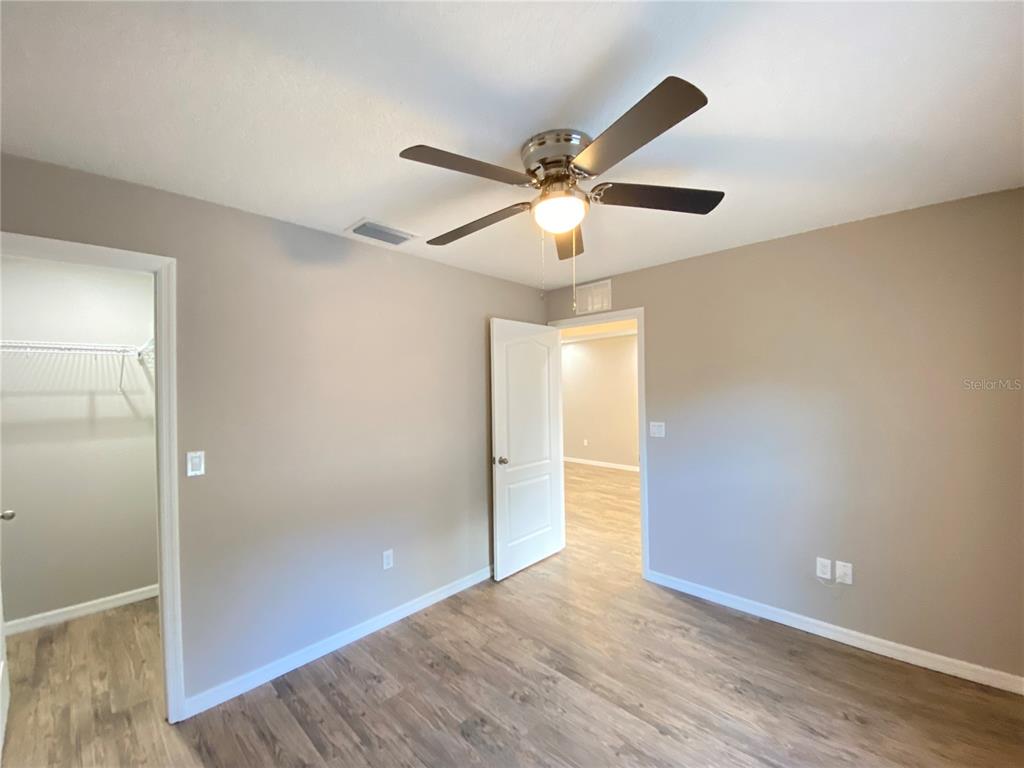 8950 North Mendoza Way Citrus Springs, FL 34434 - Photo 20 of 35 wooden floor in an empty room