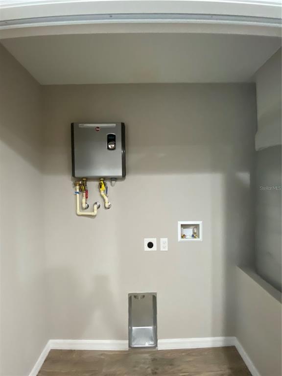 8950 North Mendoza Way Citrus Springs, FL 34434 - Photo 23 of 35 a view of a hallway with wooden floor