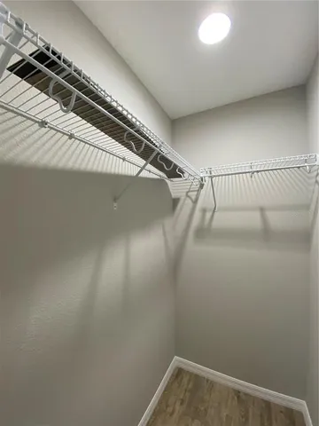 a view of a room with racks on the wall